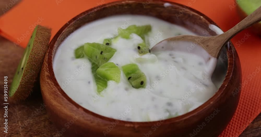 milk fresh yogurt with kiwi flavor and kiwi slices, fresh yogurt made from natural ingredients with kiwi milk fresh yogurt with kiwi flavor and kiwi slices, fresh yogurt made from natural ingredients with kiwi