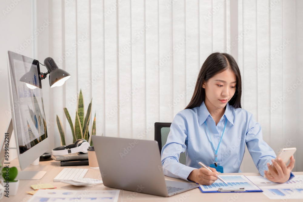 Business people is using mobile phone for analyzing sales graph for plan their investments. Business people is using mobile phone for analyzing sales graph for plan their investments.