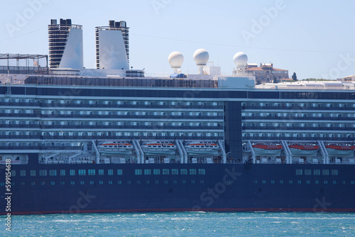 Cruise ship in city port in city port for tourist travel on sunny day. It waits at the port of Galataport , the tourist port of Istanbul. photo