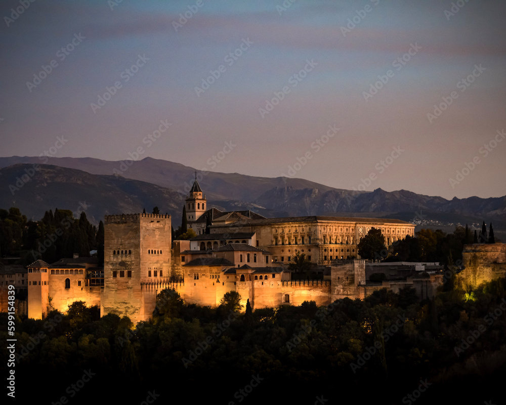 Illumination of the Alhambra in Granada at nightfall