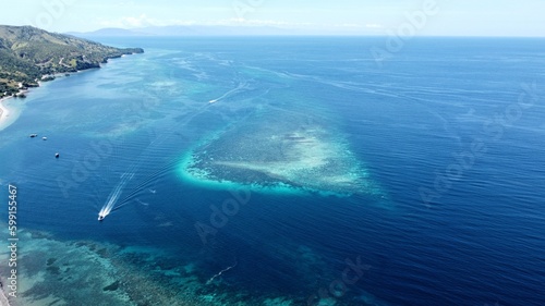 Aerial view of coral reef ecosystem and vast blue ocean off remote tropical Atauro island in Timor-Leste