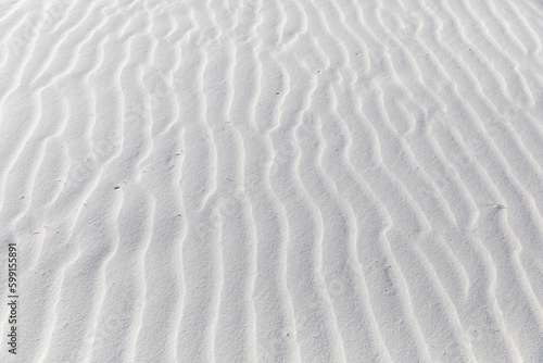 Fototapeta Naklejka Na Ścianę i Meble -  Close up of patterns the wind has blown into white sand