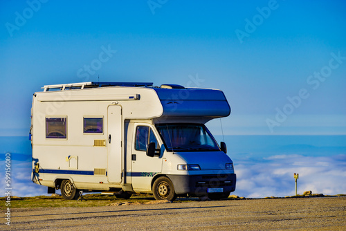 Rv camper in mountains above clouds