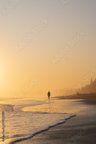 Man walking in to the sunset 