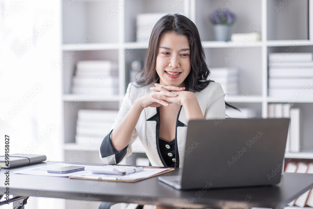 Financial Business asian women analyze the graph of the company's performance to create profits and growth, Market research reports and income statistics, Financial and Accounting concept. Financial Business asian women analyze the graph of the company's performance to create profits and growth, Market research reports and income statistics, Financial and Accounting concept.