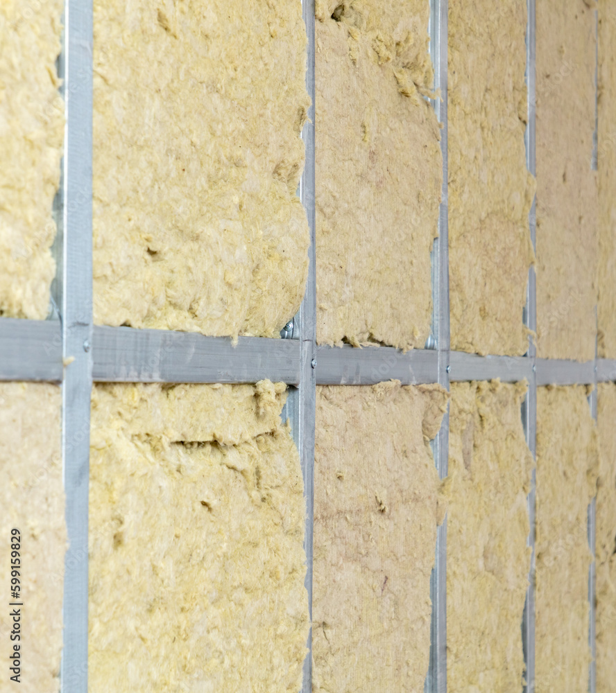 Insulation and glass wool in the wall of the room Insulation and glass wool in the wall of the room
