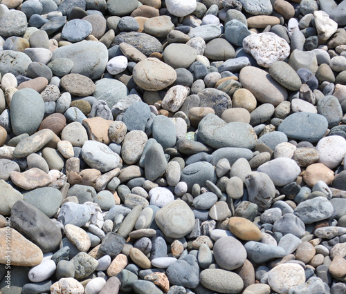 Stone pebbles as an abstract background. Texture.