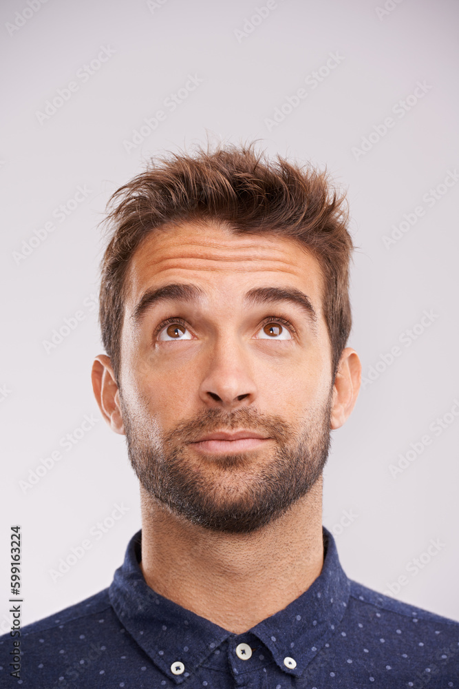 Thinking, looking up and man in studio with solution, ideas and relax with eyes and mockup. Isolated, gray background and male model face think and distracted with planning with decision alone Thinking, looking up and man in studio with solution, ideas and relax with eyes and mockup. Isolated, gray background and male model face think and distracted with planning with decision alone