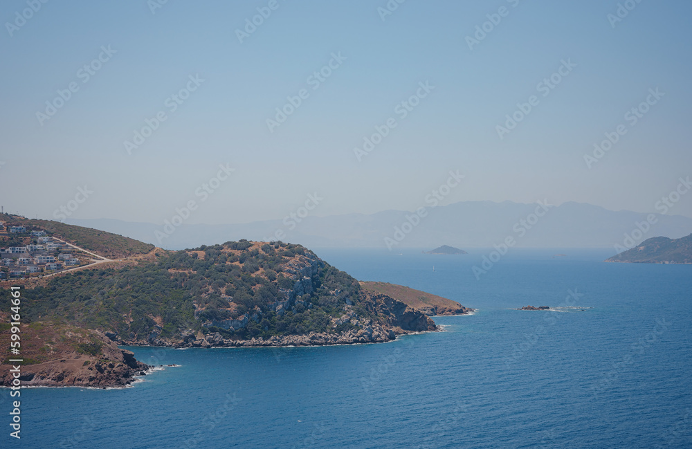 Bodrum summer travel to Turkey. Summer noon sea village Gumusluk Mugla province, bay with clear blue water