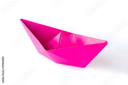 Pink paper boat origami isolated on a white background