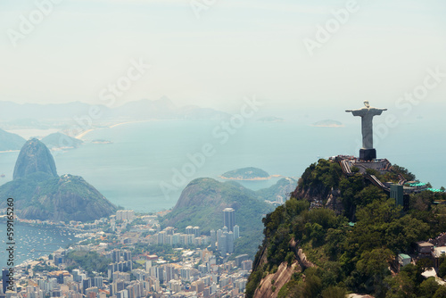 Brazil, monument and aerial of Christ the Redeemer on hill for tourism, sightseeing and travel destination. Traveling, Rio de Janeiro and drone view of statue, sculpture and city landmark on mountain
