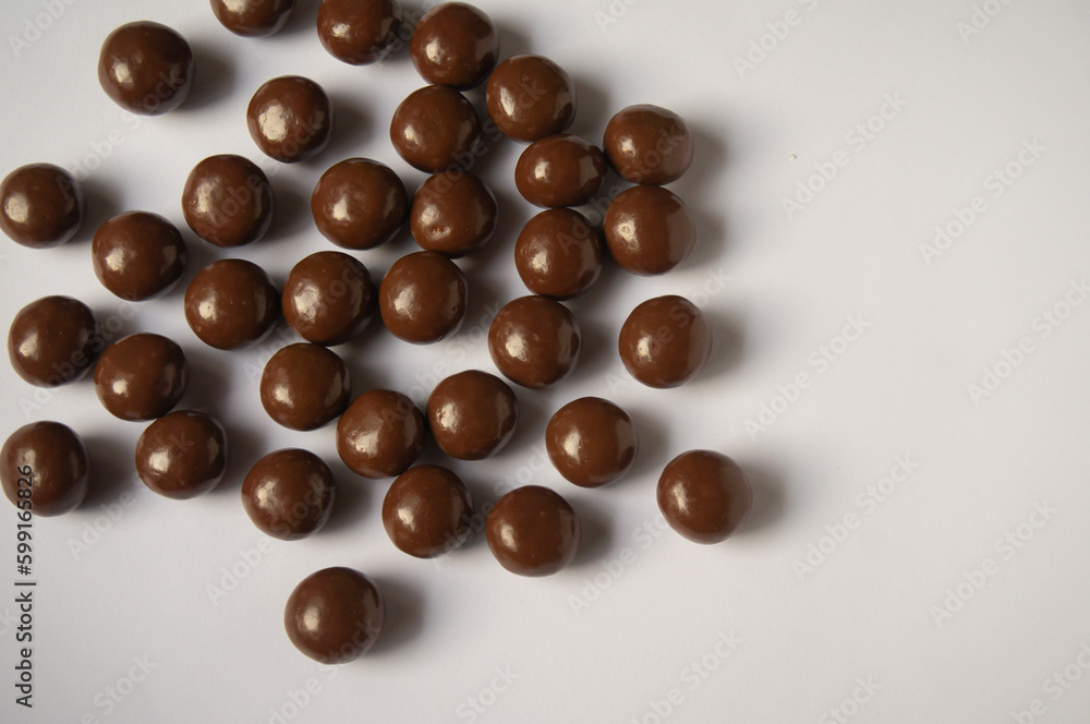 sweet chocolate balls on a white background
sweet chocolate balls on a white background