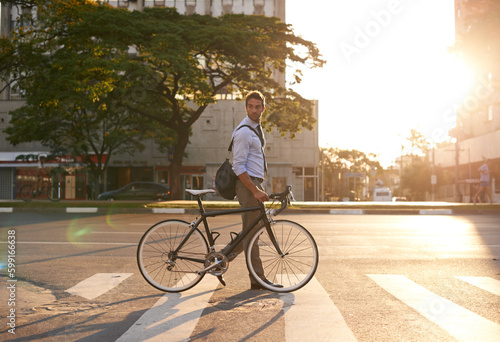 Fototapeta Naklejka Na Ścianę i Meble -  Morning, bike and business man in city for commute, travel and carbon footprint. Cycling, transportation and urban with male employee walking on crosswalk for journey, transit and professional