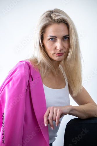 Cheerful business girl with pink weight