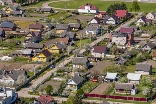 panoramic aerial view of private development with country houses or village