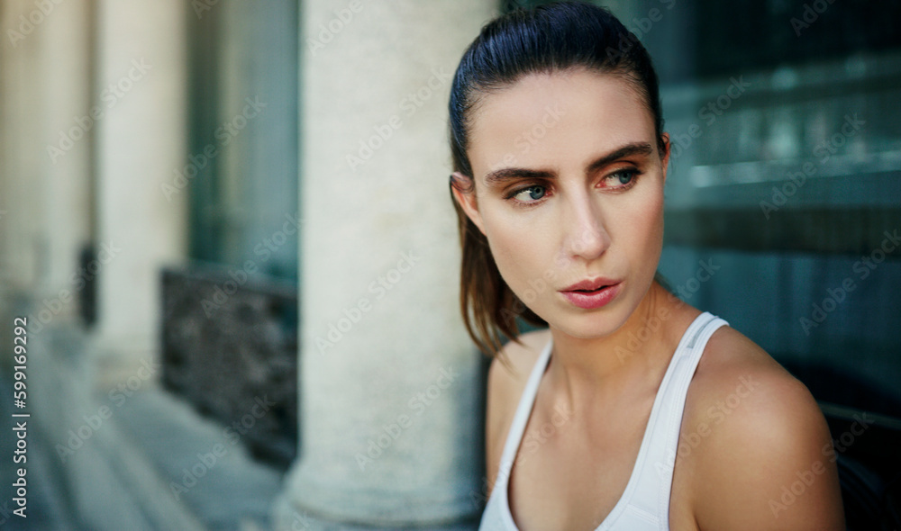 Your thoughts are the key to good health. a young woman going for a workout in the city.