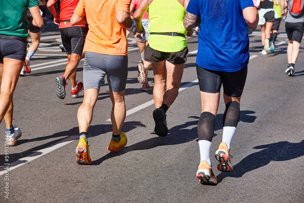 Runners on the street. Healthy lifestyle. Jogging exercise. Athletics Runners on the street. Healthy lifestyle. Jogging exercise. Athletics