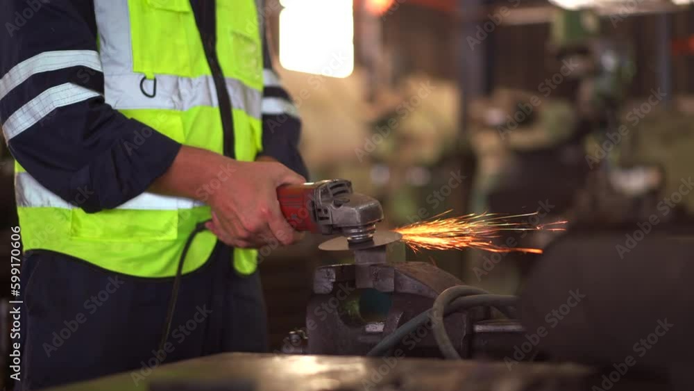 Heavy industry metal work worker using metal grinder machine sharpening a metal pipe close up. Heavy industry metal work worker using metal grinder machine sharpening a metal pipe close up.