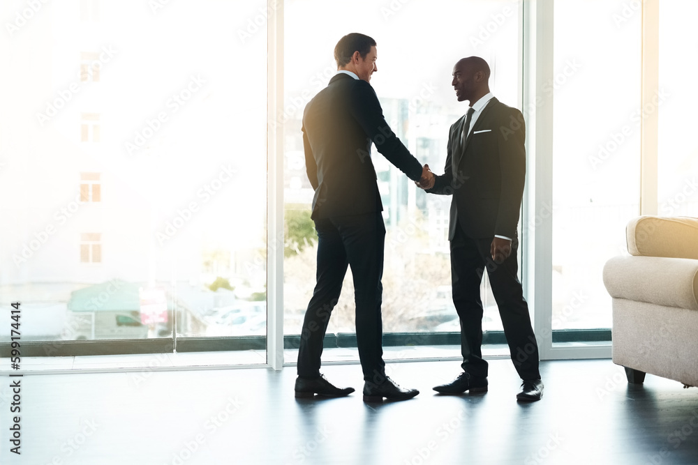 New business relationships bring about new opportunities. Full length shot of two businessmen shaking hands in an office. New business relationships bring about new opportunities. Full length shot of two businessmen shaking hands in an office.