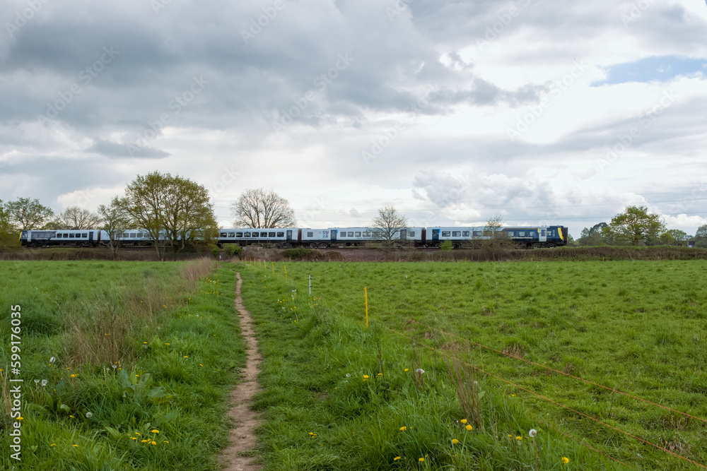 SWR train travelling through the countryside on a stormy spring day SWR train travelling through the countryside on a stormy spring day
