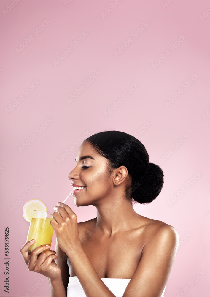 Vitamin c is good for you. a beautiful young woman drinking a glass of fruit juice. Vitamin c is good for you. a beautiful young woman drinking a glass of fruit juice.