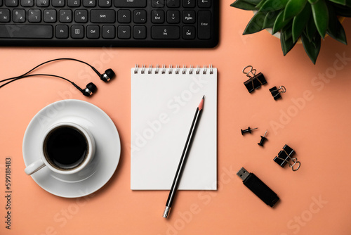 Planning, business, office work, stationery, or an education concept: on top is an image of an open notebook with a blank page, ready for addition or layout. Top view of stationery