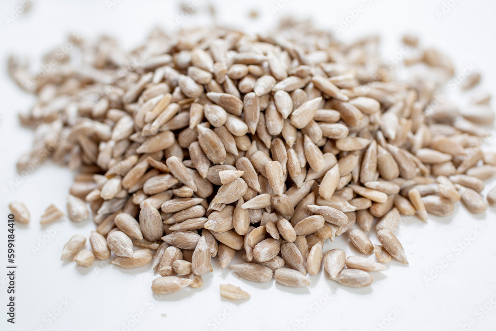 A pile of unroasted, cleaned sunflower seeds A pile of unroasted, cleaned sunflower seeds