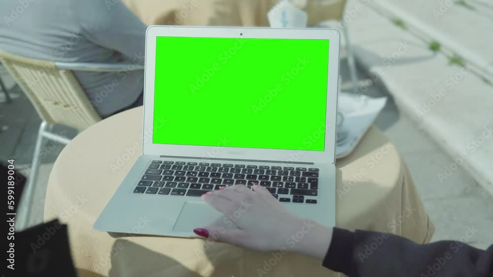 Hands open laptop with chroma key screen Hands open laptop with chroma key screen