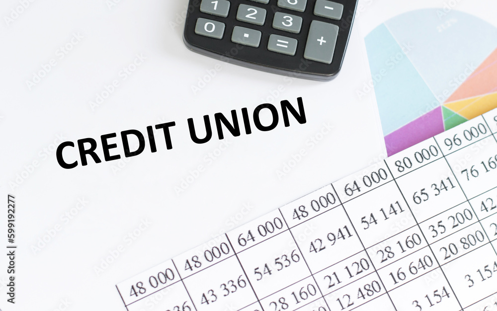 CREDIT UNION - text concept on notepad. The inscription credit union on a notepad next to the calculator.Financial concept. CREDIT UNION - text concept on notepad. The inscription credit union on a notepad next to the calculator.Financial concept.