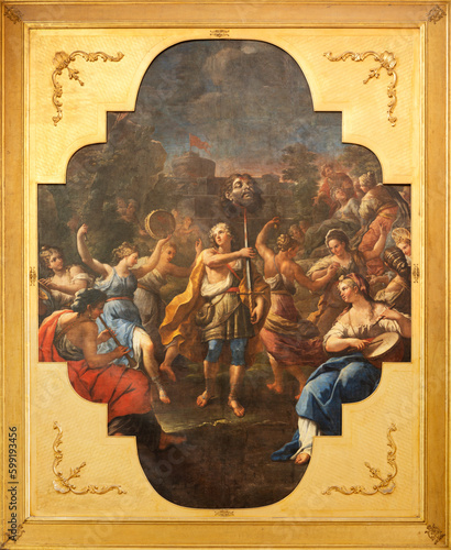 NAPLES, ITALY - APRIL 24, 2023: The painting Triumph of David in church Chiesa di San Vitale Martire by Luca Giordano (1680-1686).