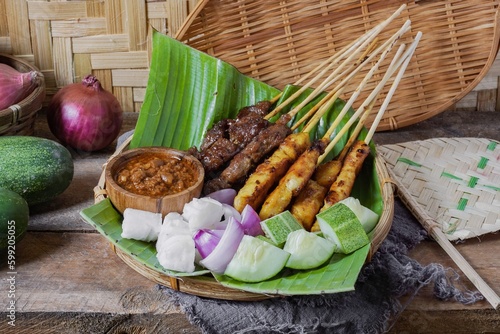 Grilled food chicken and beef satay eaten with peanut sauce is famous Malaysian and Indonesian local dishes