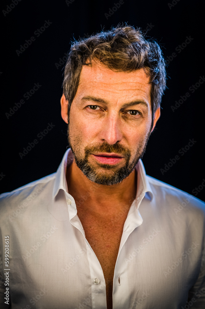 A close up of a person wearing a white shirt A close up of a person wearing a white shirt
