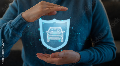 Cuadro en lienzo Human hand with protect your car and holding shield guard protective motor insur