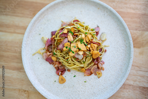 Top view of Spaghetti with bacon and fried garlic, delicious and easy-to-make pasta dish that is perfect for a quick weeknight meal