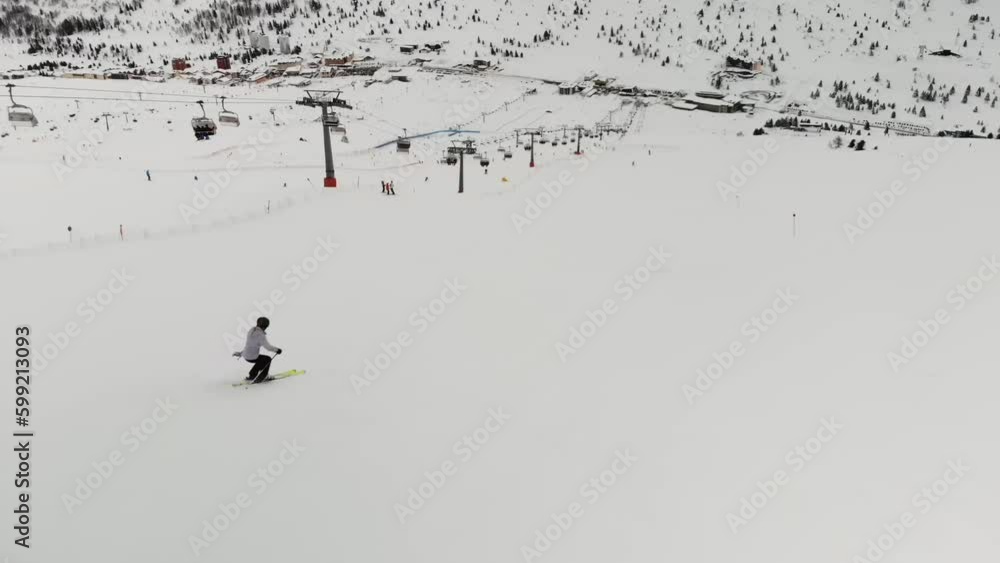 Aerial video of a cable car and people snowboarding and skiing Aerial video of a cable car and people snowboarding and skiing