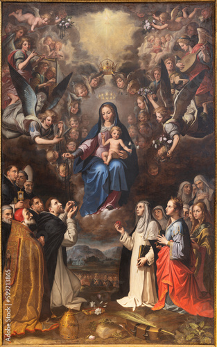 NAPLES, ITALY - APRIL 20, 2023: The painting of Madonna queen of Rosary in his Glory in the church Basilica di Santa Maria della Sanita by Giovanni Bernardo Azzolino (1612 - 1614).