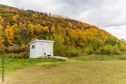 Jekthamna is a small but beautiful inlet surrounded by trees in autumnal colors in Senja island, Troms og Finnmark, Norway photo