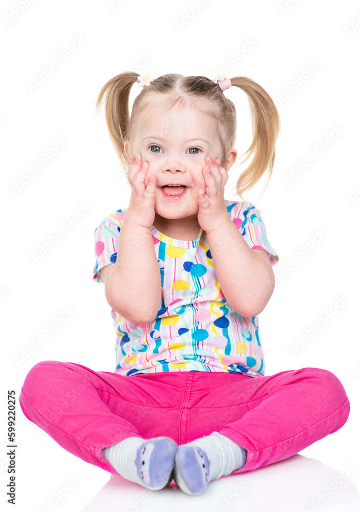 Happy little girl with Downs syndrom looks at camera. Isolated on white background Happy little girl with Downs syndrom looks at camera. Isolated on white background