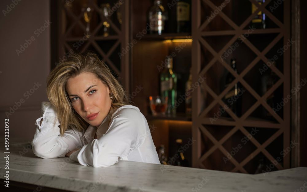 Portrait of pretty woman in a bar or club, concept of drinks, beverage Portrait of pretty woman in a bar or club, concept of drinks, beverage