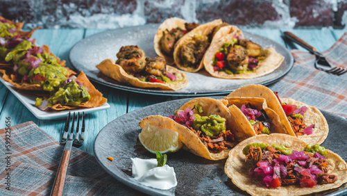 Mexican food, dishes of tacos and nachos.