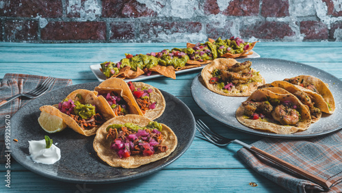 Mexican food, dishes of tacos and nachos.