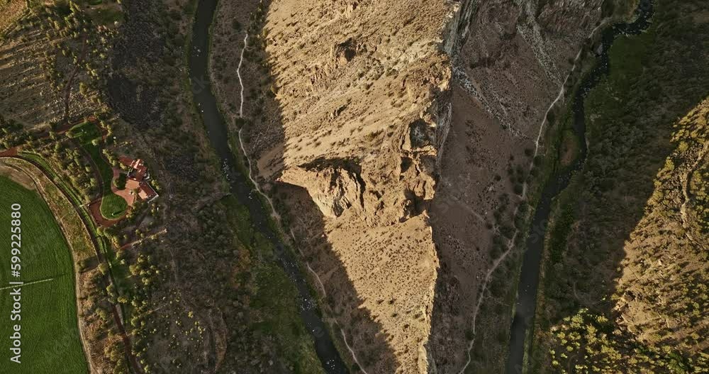 Terrebonne Oregon Aerial v54 vertical top down view, flyover Smith Rock State Park capturing winding crooked river and unique canyon rock formation from above - Shot with Mavic 3 Cine - August 2022 Terrebonne Oregon Aerial v54 vertical top down view, flyover Smith Rock State Park capturing winding crooked river and unique canyon rock formation from above - Shot with Mavic 3 Cine - August 2022