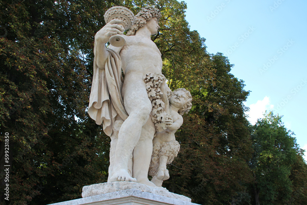 statue of a mythological character in the park of a castle in france 
