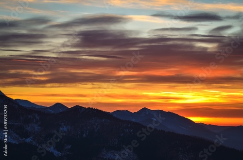 Beautiful mountain theme to use for example as a background. Colorful sunset over the peaks in the Polish Tatra Mountains. © shadowmoon30