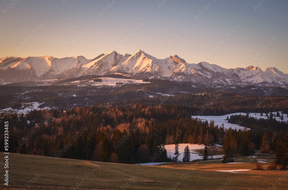 Charming panorama of the Polish Tatra Mountains in the morning. View of the High Tatras from the village of Lapszanka, Poland.