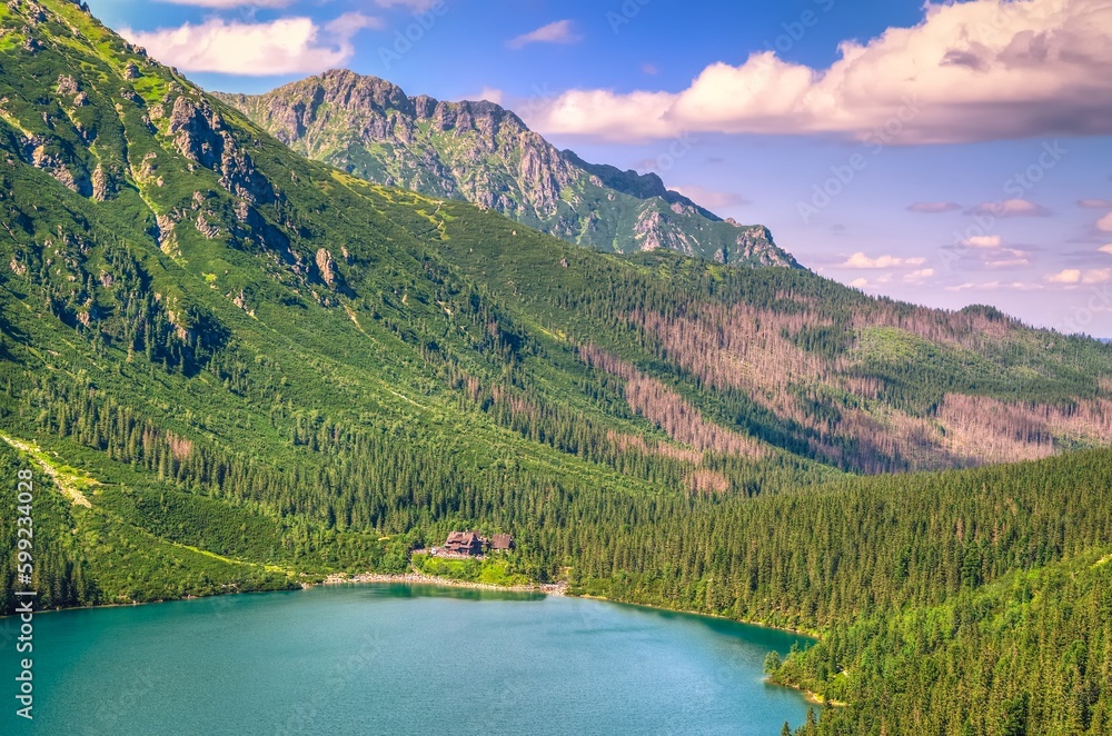 Mountain landscape in sunny holiday day. Lake in mountains. Sea Eye (Morskie Oko) Lake is the most popular place in High Tatra Mountains, Poland.