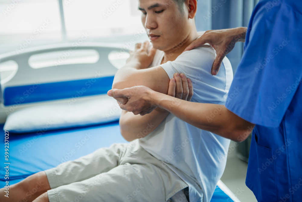 Fototapeta premium Male Doctor and patient suffering from back pain during medical exam..