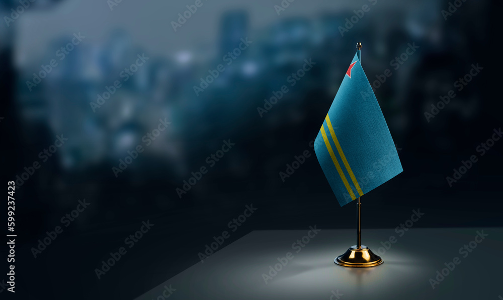 Small flags of the Aruba on an abstract blurry background