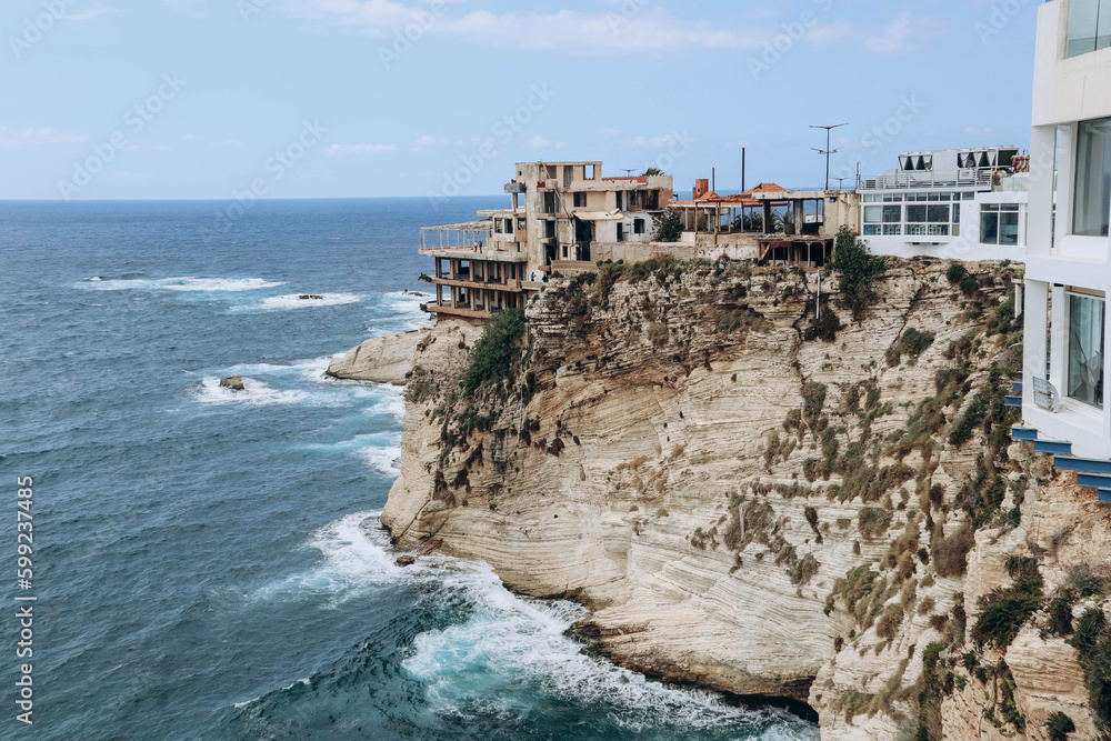 Beirut, Lebanon — 24.04.2023: Abandoned restaurant on the waterfront of Beirut overlooking the famous Pigeon Rocks