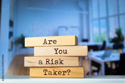 Wooden blocks with words 'Are You a Risk Taker?'.